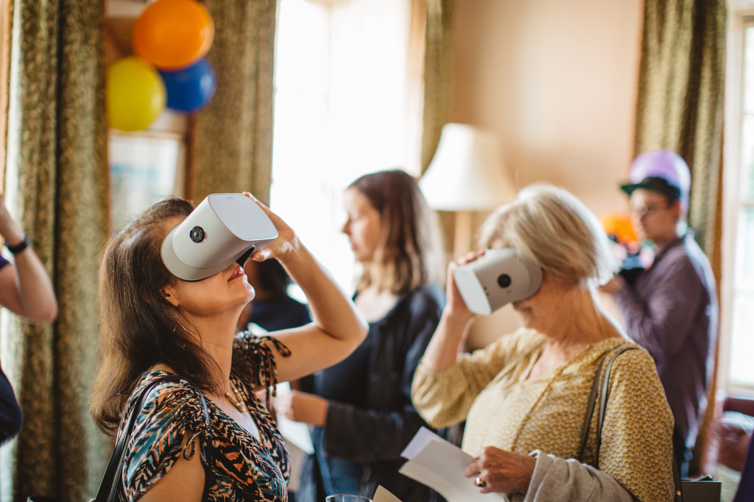 People experimenting with VR headsets, Futures, 2019 Photo: Ben Pryor