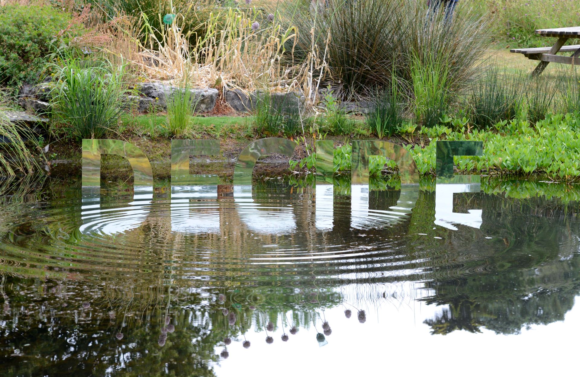 Upon Reflection: text-based sculpture, The Impossible Garden, University of Bristol's Botanic Garden. ArtistL Luke Jerram. Photo: ??